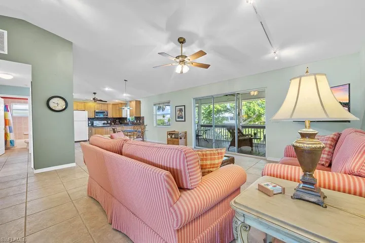 Tiled living room with vaulted ceiling