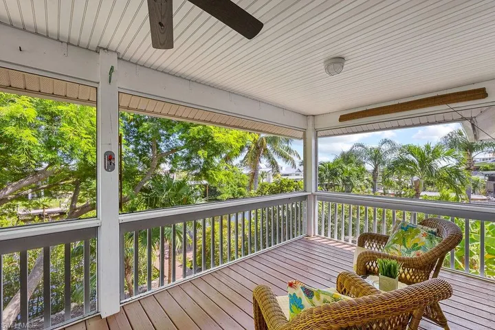 Screened lanai with views of the water and trees