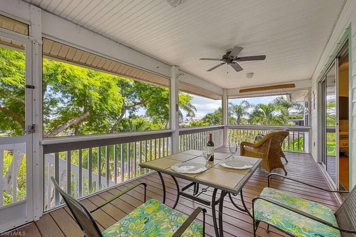 Screened porch with views of water and nature.