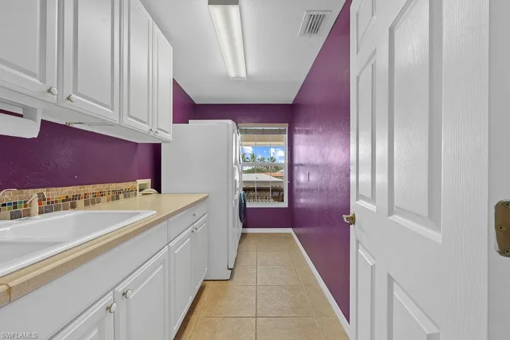 Large Laundry room with additional refrigerator