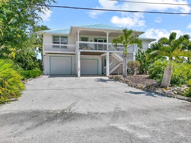 Beach home- Apartment entrance to the right behind the stairs to main living quarters.