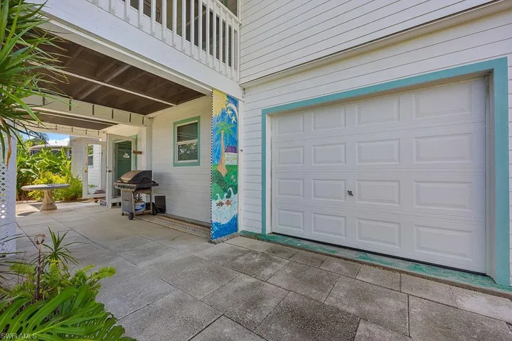 View of back entrance to the garage & back entrance to apartment