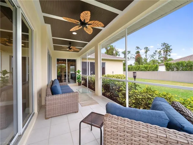 Sunroom featuring ceiling fan