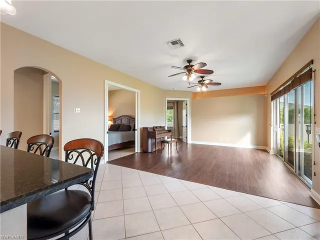 Dining room featuring ceiling fan, a healthy amount of sunlight, and light hardwood / wood-style flooring