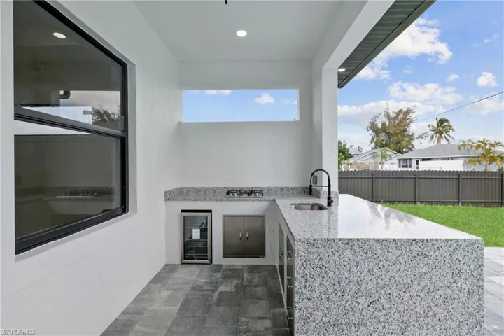 View of patio / terrace with sink and area for grilling