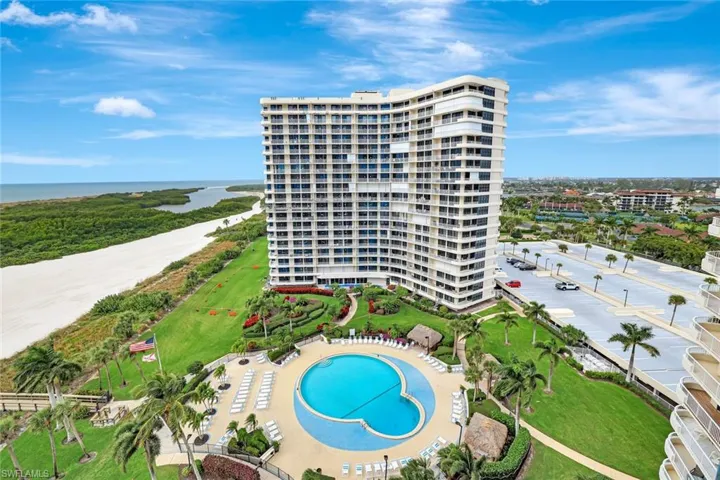 Bird's eye view of apartment complex and a nearby body of water