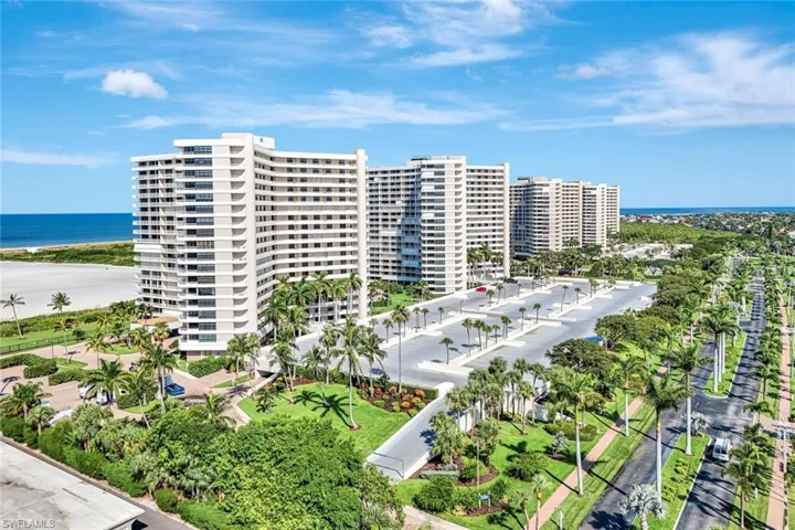 Aerial view of a nearby body of water and apartment complex