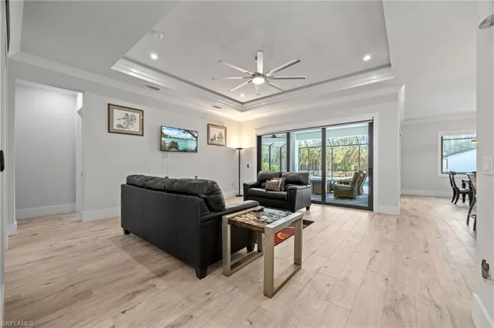 Tray ceiling, crown molding, wood plank tile flooring throughout!