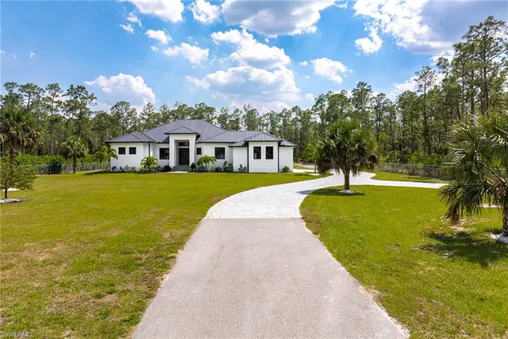 Expansive, paved driveway!  Gated!