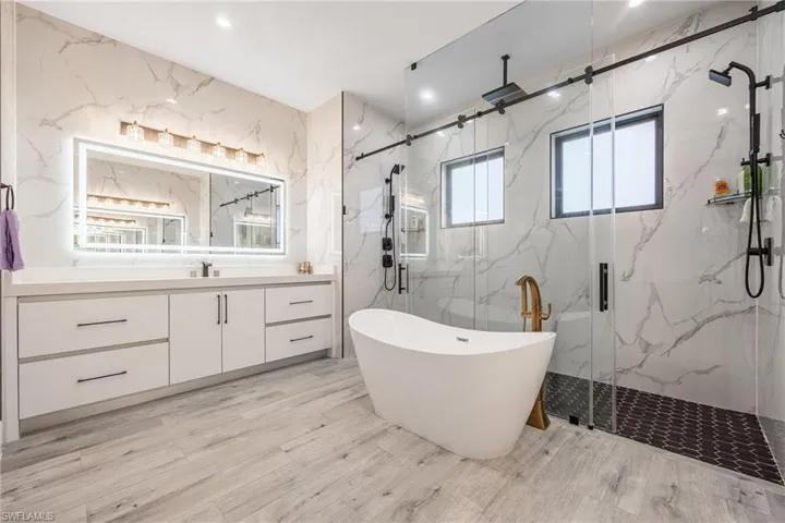 Stand alone Tub, Double entry Shower Doors!, Multiple Shower Heads, Dual Vanities!