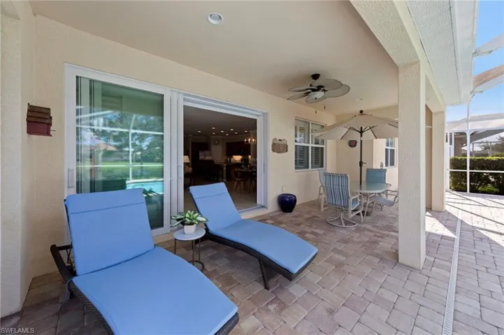 View of patio / terrace with a sunroom and ceiling fan