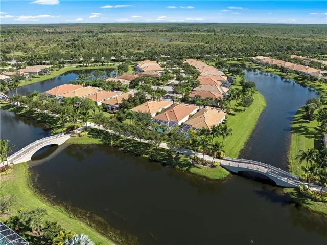 Aerial overview of property's location with nearby suburban area, a large body of water, and a notable bridge