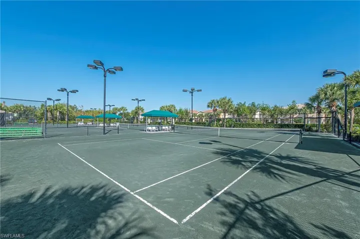 View of tennis court with community basketball court