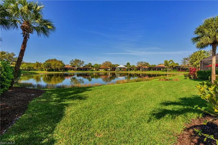 View of yard with a water view