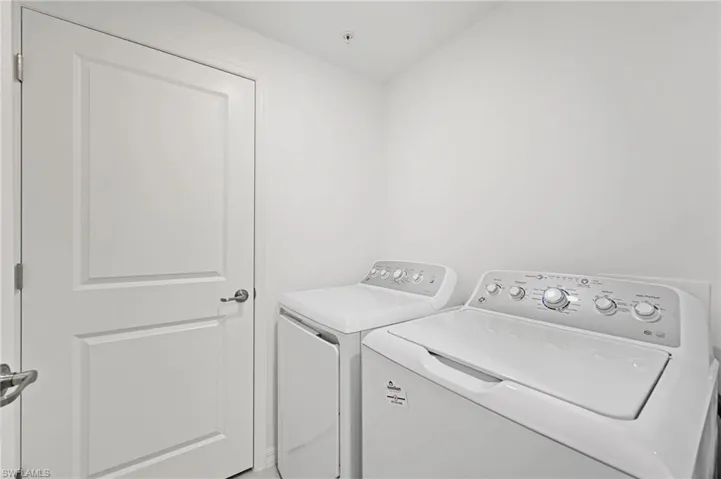 Laundry room featuring independent washer and dryer