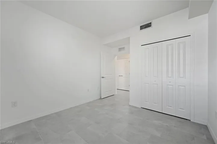 Unfurnished bedroom with baseboards and a closet