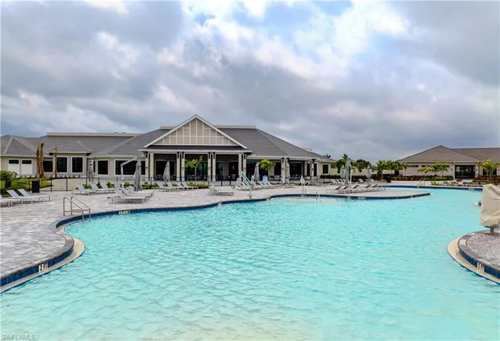 Community pool with a patio
