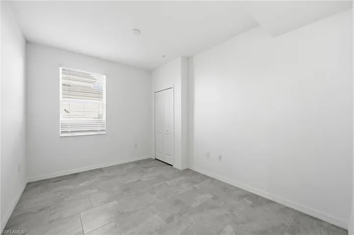 Unfurnished bedroom featuring baseboards
