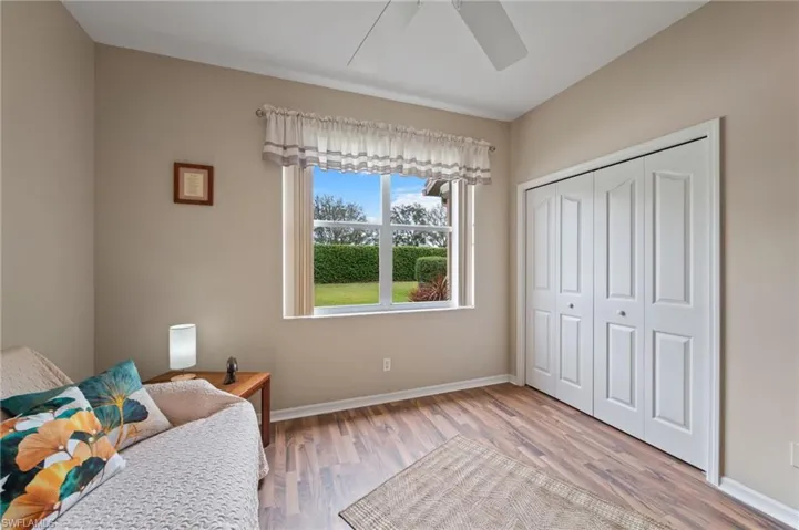 Sitting room featuring ceiling fan and hardwood / wood-style flooring