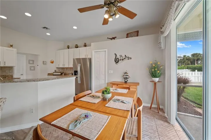 Dining area with ceiling fan