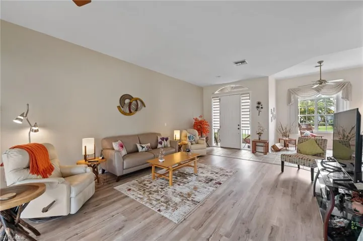 Living room featuring ceiling fan and light wood-type flooring