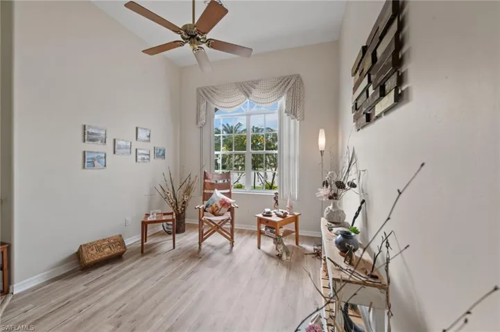 Living area featuring ceiling fan and light hardwood / wood-style floors
