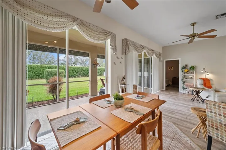 Sunroom with ceiling fan and a wealth of natural light