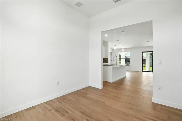 Unfurnished living room with light wood-style floors and recessed lighting