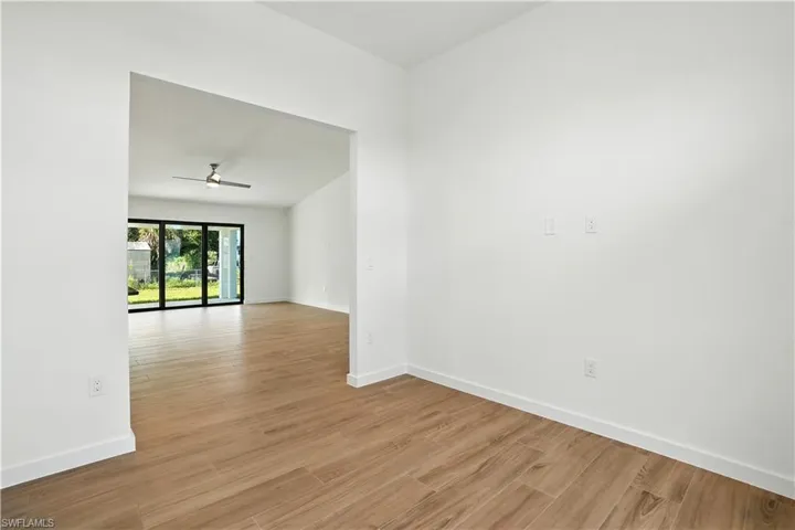 Spare room featuring light wood-style floors and a ceiling fan