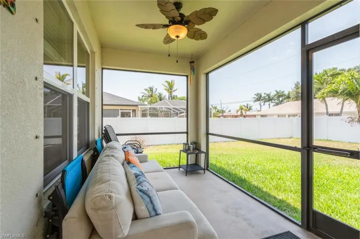 Sunroom with ceiling fan and a wealth of natural light