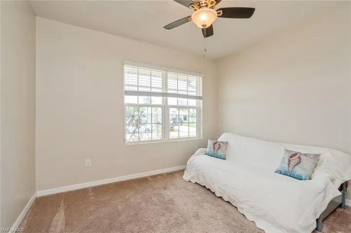 Bedroom with carpet flooring and ceiling fan