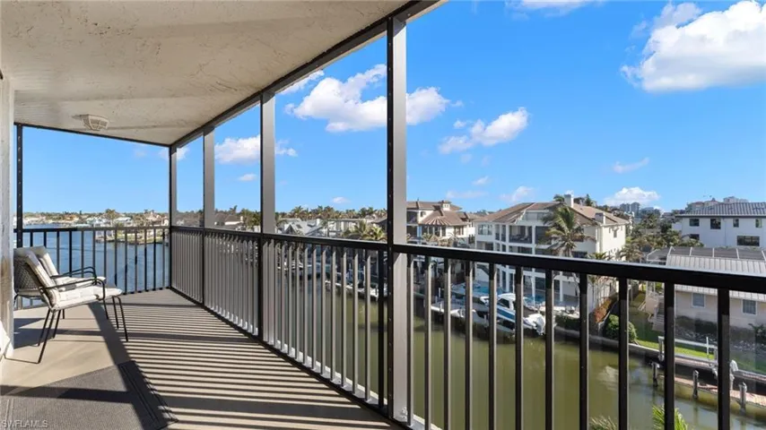 Unfurnished sunroom with a water view