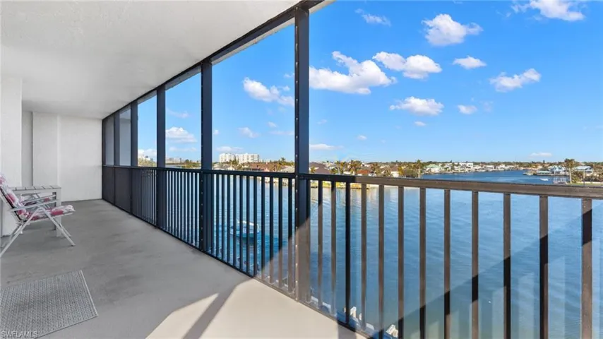Unfurnished sunroom featuring a Bay view