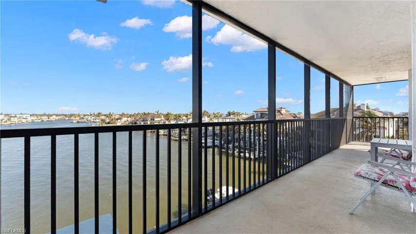 sunroom featuring a Bay view