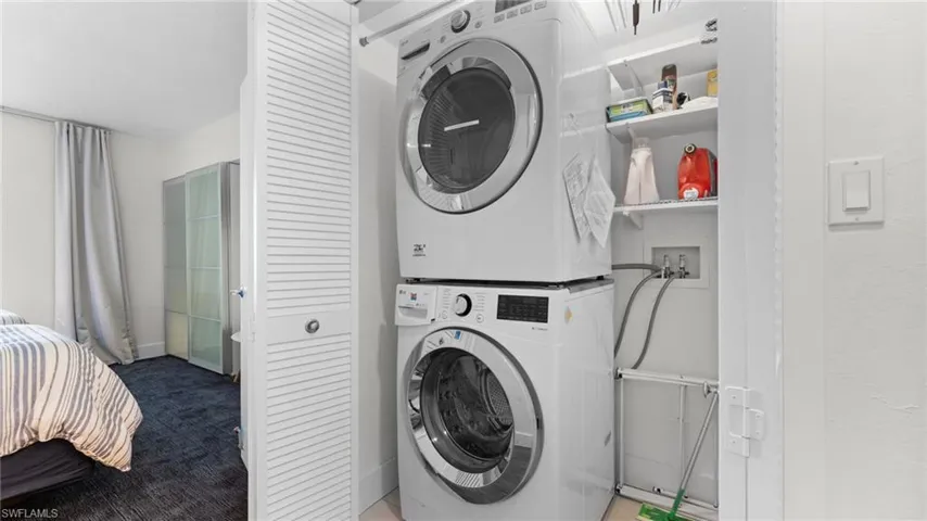 Washroom with stacked washer / dryer