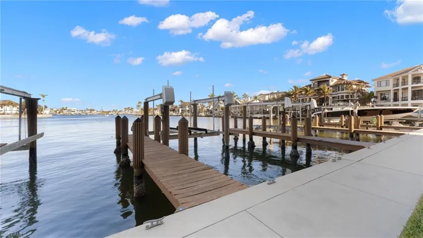 Dock area featuring a water view