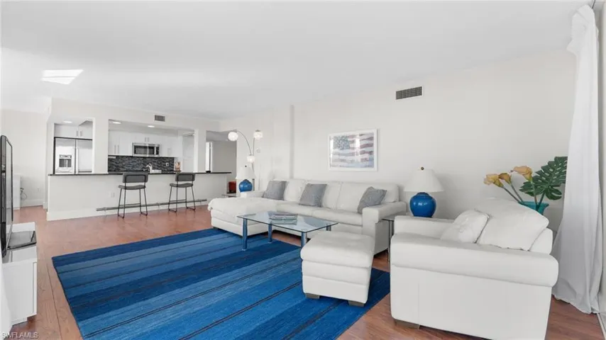 Living room with hardwood / wood-style flooring