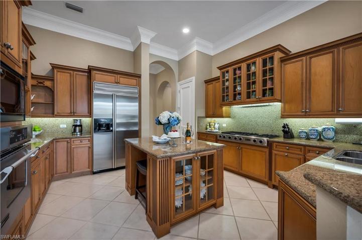 Glass cabinets display your service pieces and there are two pantries for plenty of storage.