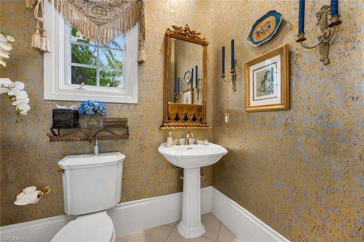 The powder room is large enough to put in shower in the corner for guests in office to use.
