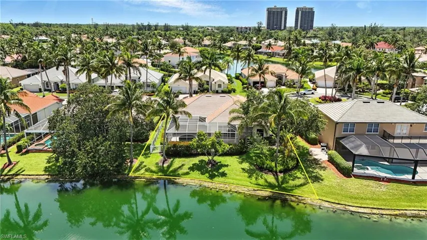 Aerial view of residential area with a nearby body of water - Virtually Edited Image