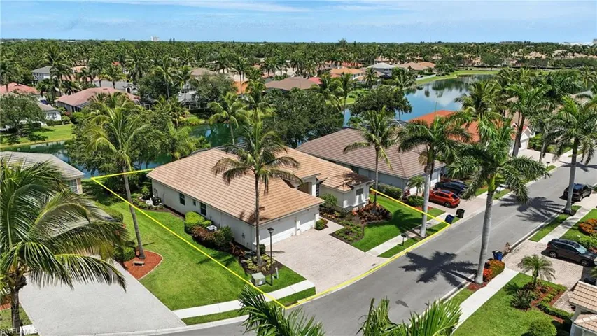 Aerial perspective of suburban area featuring a nearby body of water - Virtually Edited Image