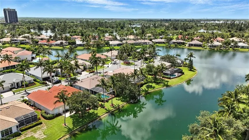 Aerial perspective of suburban area featuring a nearby body of water - Virtually Edited Image