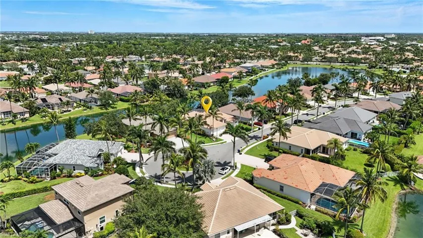 Aerial view of residential area featuring a large body of water - Virtually Edited Image