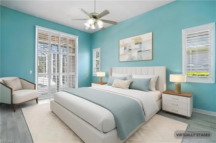 Primary Bedroom with light wood-type flooring and a ceiling fan - Virtually Edited Image