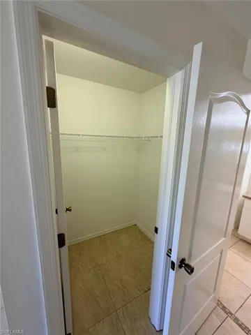 Walk in closet featuring light tile patterned floors