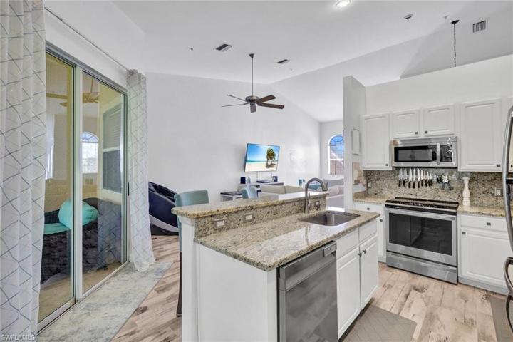 This kitchen is beautiful, bright, and open!