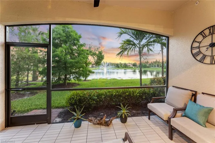 Sunroom with a water view
