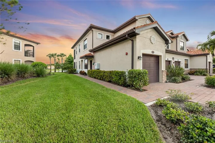 Property exterior at dusk, showing the ample side yard
