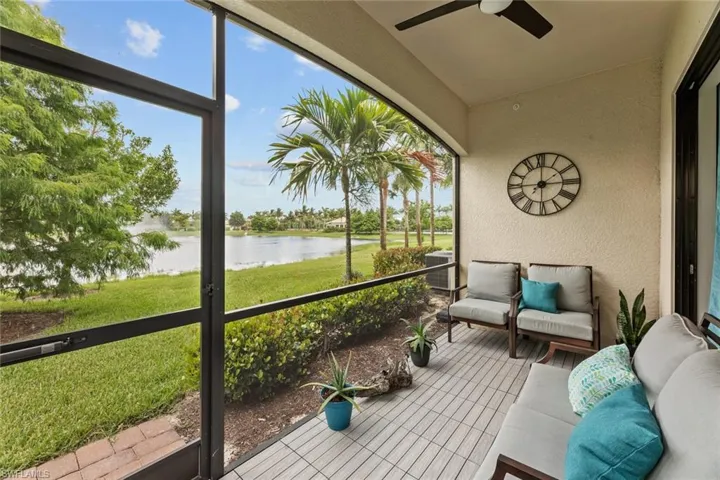 Sunroom with a water view and ceiling fan