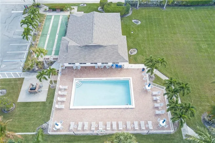 Aerial view of property and surrounding area with a pool area